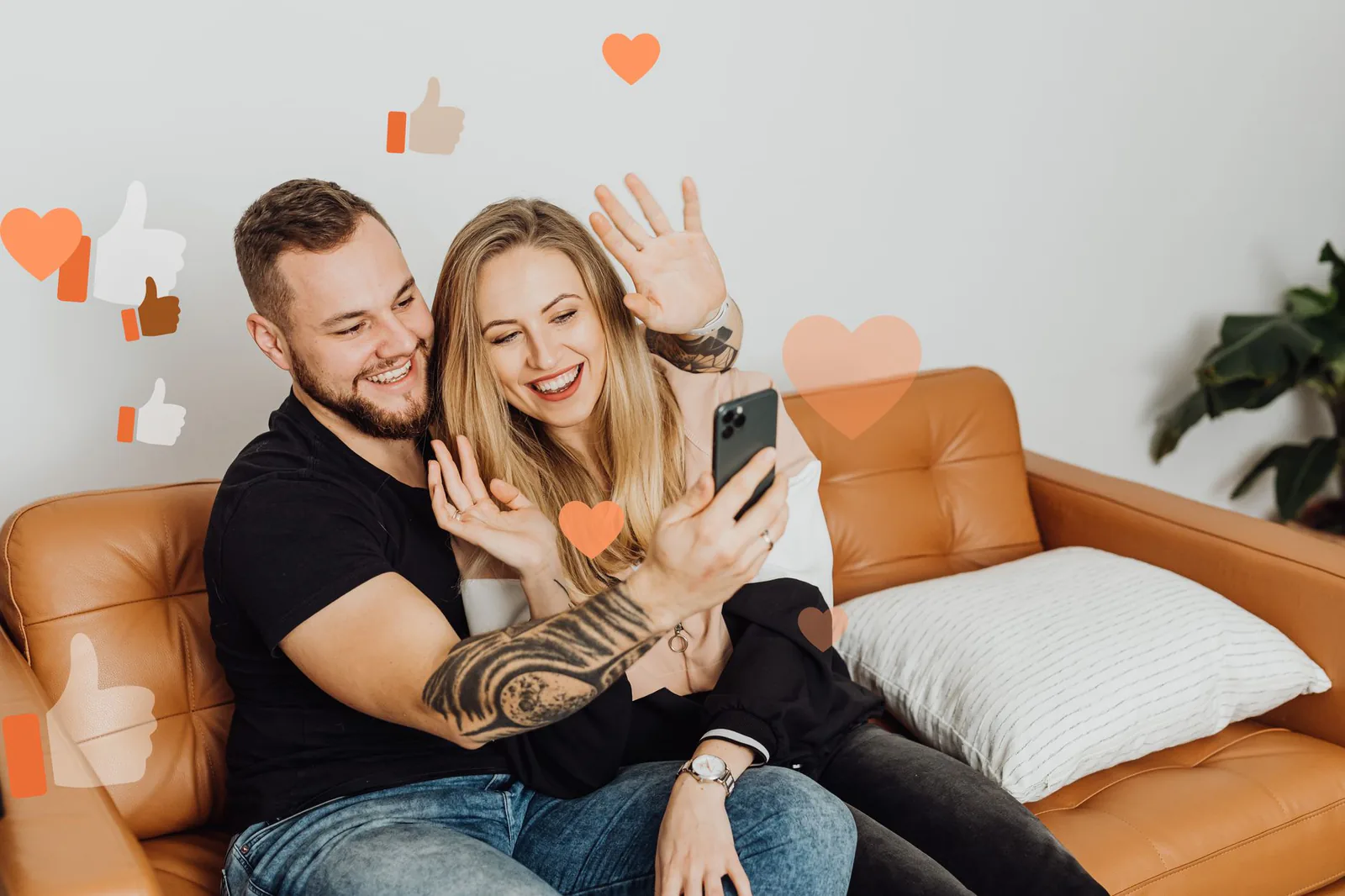 A smiling couple making a video call from home